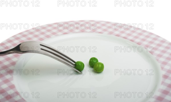 Plate with peas and centimeter measure