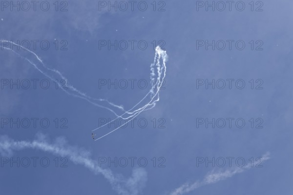 Airshow, glider contrails against blue sky, Montreal, Province of Quebec, Canada, North America