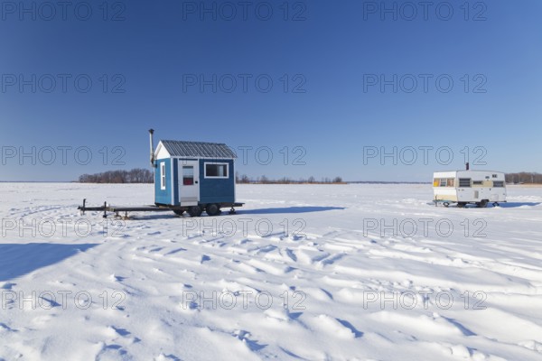 Winter, ice fishing hut on the Saint Lawrence River, Province of Quebec, Canada, North America