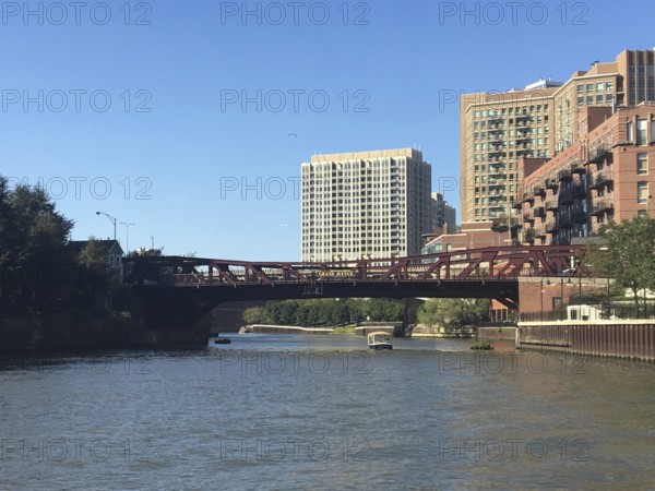 Urban environment with bridge and modern buildings along a river in sunshine, chicago, illinois,