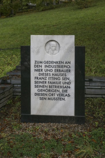 Probstzella, HAUS DES VOLKES, modern memorial stone in the park with marble relief of the founder
