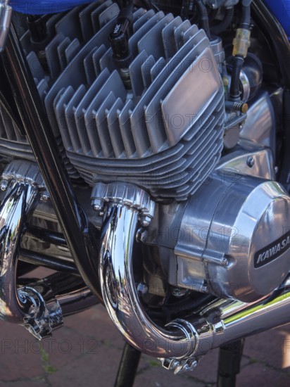 Close-up of a Kawasaki motorbike engine with blue and chrome-plated components, Appelhülsen,