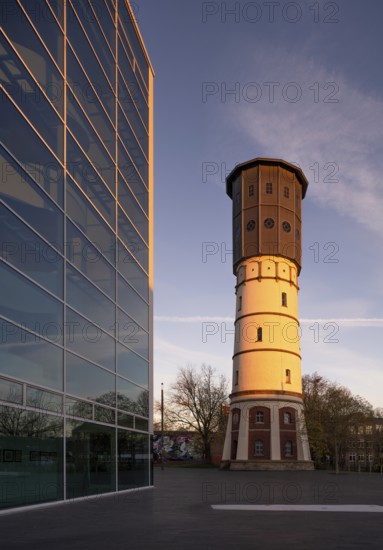 Gütersloh, historic water tower, on the left the façade of the theatre, built 2008-2010 by Jörg