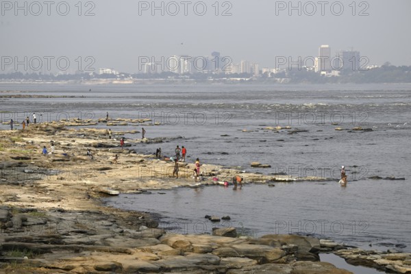 Women washing their laundry at the Congo River near the Malebo pool, formerly Stanley pool,