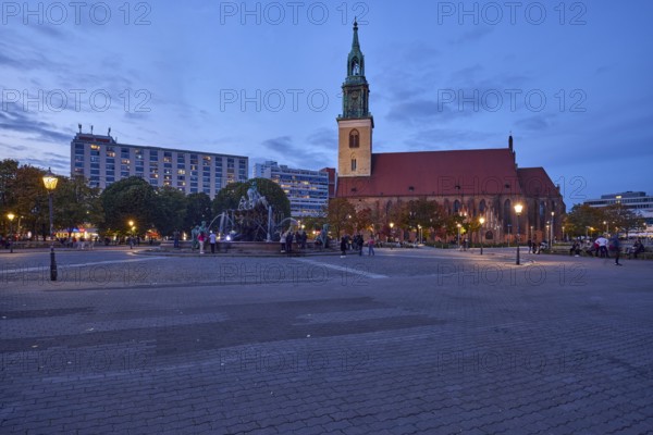 St. Mary's Church with Neptune Fountain and lanterns at dusk, Berlin, capital city, independent
