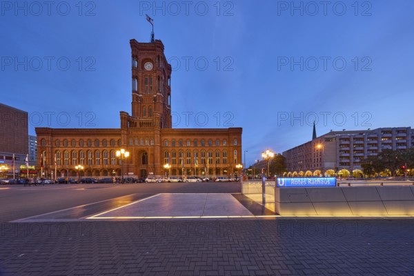 Red Town Hall with underground station and lanterns at dusk, Rathausstraße, Berlin, capital city,