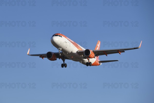 Lisbon, Portugal - September 2, 2023: easyJet Airbus A320-214 passenger plane descends to land in