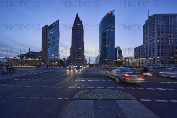 High-rise buildings Forum Tower, Kollhoff-Tower and Bahntower with car traffic in the blue hour at
