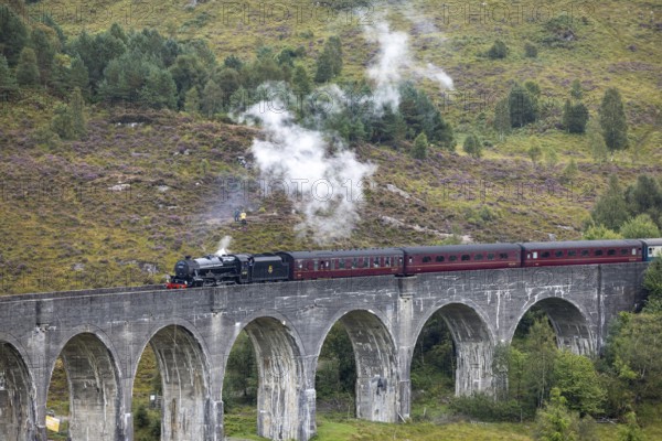 The Jacobite Steam Train, steam railway on the Glenfinnan railway viaduct, known from Harry Potter,