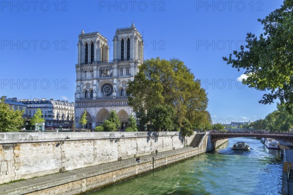 Notre-Dame de Paris is a medieval Catholic cathedral in Paris. View of cathedral facade from Seine