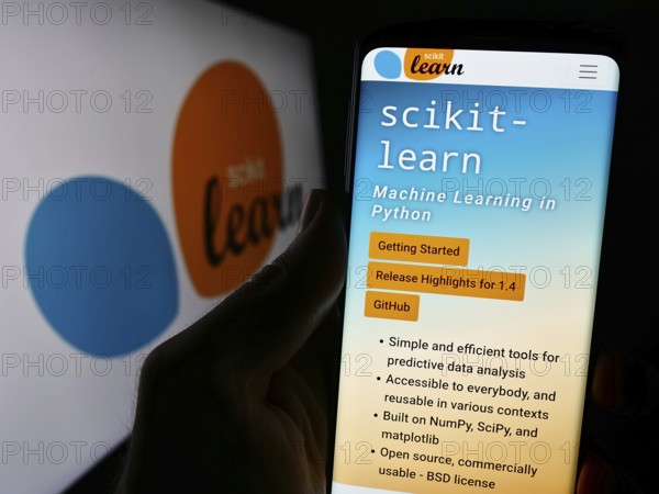 Stuttgart, Germany, 03-08-2024: Person holding cellphone with webpage of software machine learning