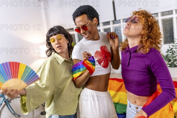 Lgbt multi-ethnic and gender students partying at home celebrating pride