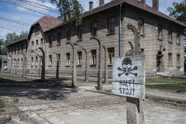 The sign with the word Stop in German and Polish in the German nazi concentration camp Auschwitz