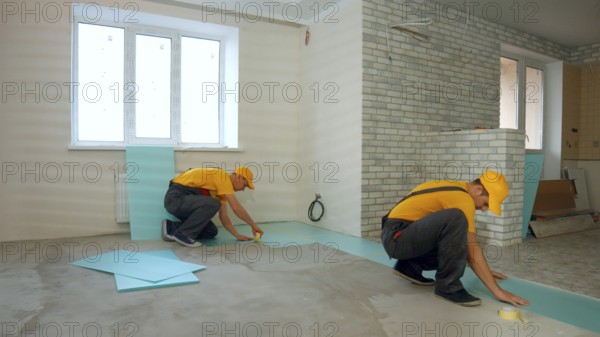 Builders insulated floor in a large house. Thermal insulation of the floor in the apartment