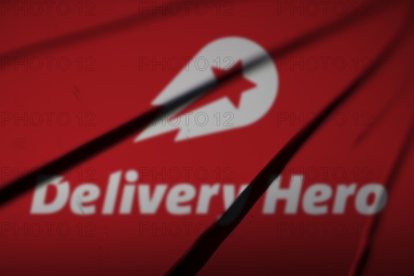 Dhaka, bangladesh- 06 Oct 2024: Delivery Hero logo is visible on the broken glass