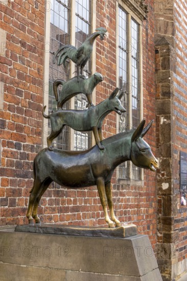 The famous bronze statue of the Bremen Town Musicians with the figures of a donkey, dog, cat and
