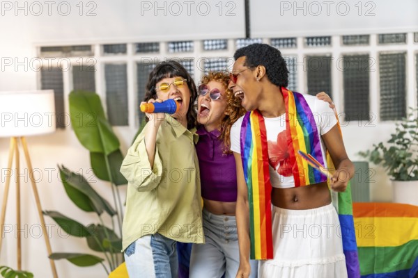 Multi-ethnic and gender diverse lgbt friends singing karaoke during pride party at home