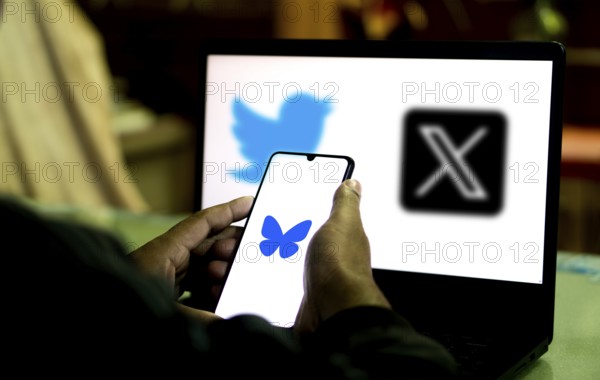 Bluesky logo is displayed on smartphone and X (twitter) logo on the background.