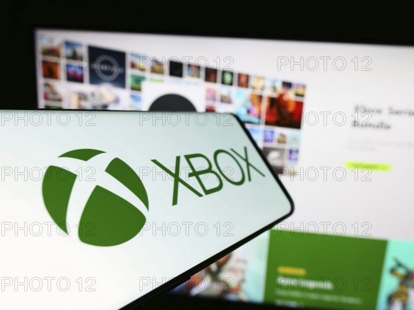 Stuttgart, Germany, 02-14-2024: Mobile phone with logo of video game console Xbox (Microsoft) in