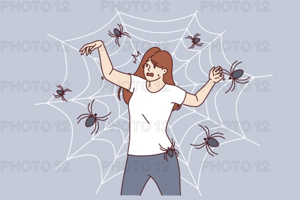 Woman with fear of spiders is terrified of being entangled in cobweb and needs treatment for