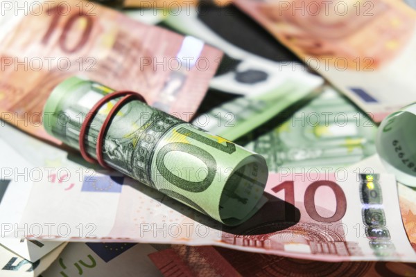 Close up of Euro money roll. Euro banknote set cash money, EU currency. Rolled with rubber euro