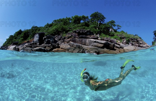 Snorkellers in front of tropical island, Similan Islands, Andaman Sea, Phuket, Thailand, Asia