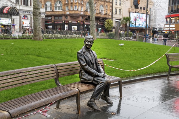 London, UK, March 22, 2024 : Statue of Mr Bean sitting on a bench. Rowan Atkinson bronze statue in