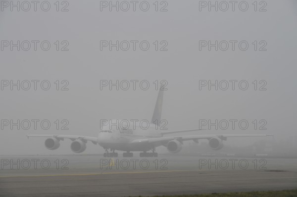Lufthansa Airbus A380-800 taxiing in the fog, Terminal 2, Munich Airport, Upper Bavaria, Bavaria,