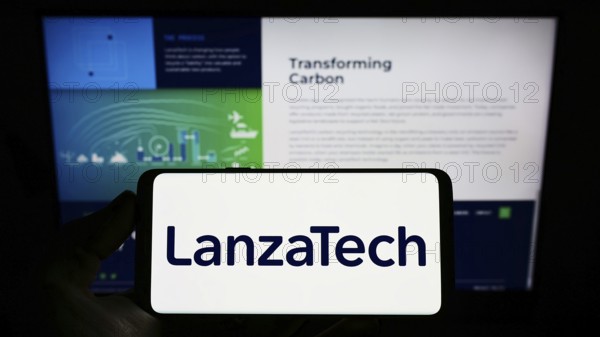 Stuttgart, Germany, 03-12-2022: Person holding cellphone with logo of US carbon recycling company