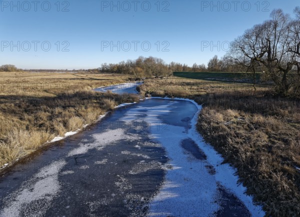 Icy drainage ditch on a winter's day in the floodplains of the Elbe valley near Neu Goldbeck.