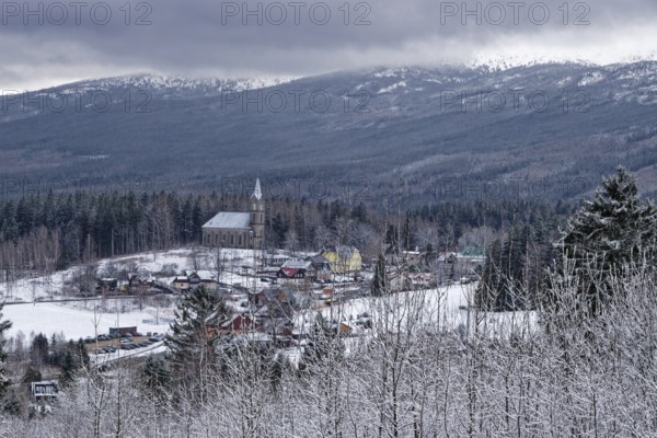 The Kosciól church pw. Bozego Ciala in front of the Giant Mountains. Szklarska Poreba, Jelenia