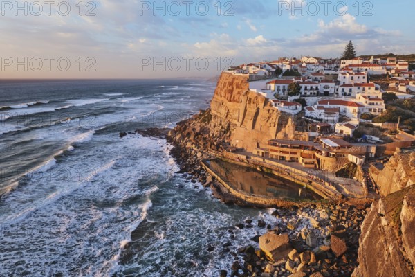Scenic view of the seaside Azenhas do Mar fishing village on cliff on Atlantic ocean coast,