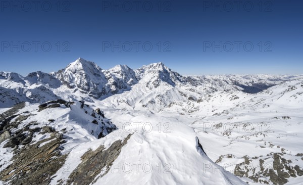 Mountain panorama with snow-covered mountain landscape in winter, view of mountain peaks