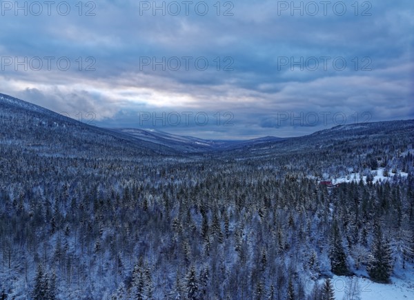 Huge wooded areas, mixed forest covered in snow, characterise the landscape between Szklarska