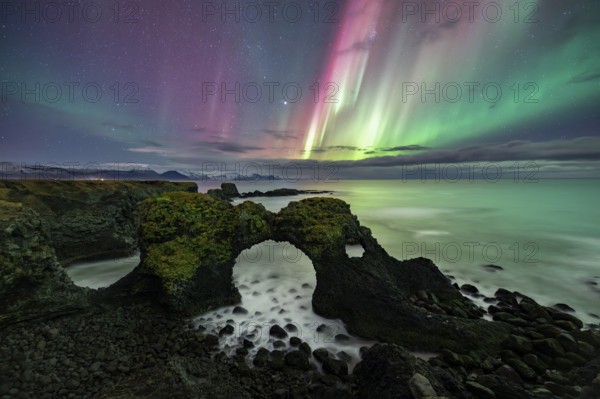 Northern lights over rock structure, coast near Arnarstapi, Snäfellsnes peninsula, Snæfellsnes,