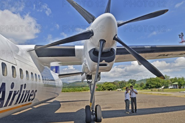 Propeller aircraft, Jet-Prop Fokker 50, former Riau Airlines, at the airport in Labuan Bajo, Flores
