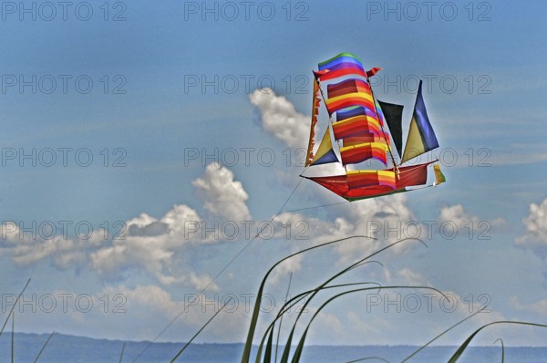A flying dragon in the shape of a ship against a blue sky, Bali, Indonesia, Asia