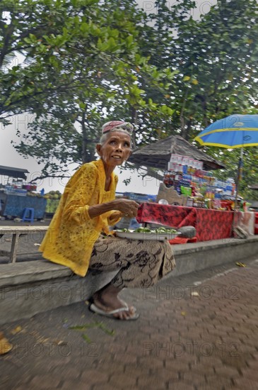 Old lady selling drinks near Amed, Bali, Indonesia, Asia