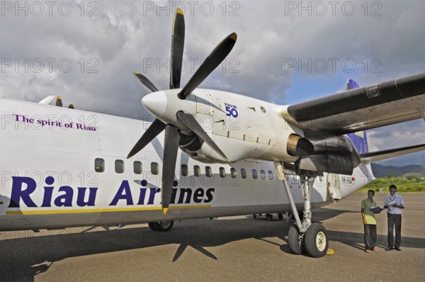 Fokker 50 turboprop, prop jet of the former Riau Airlines, arriving in Labuhan Bajo, Flores,