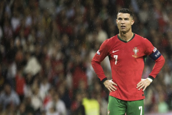 Football match, captain Cristiano RONALDO CR7 Portugal in the rain, with both hands on hips and