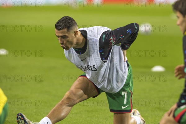 Football match, Cristiano RONALDO CR7 Portugal kneeling during pre-match warm-up with right leg and