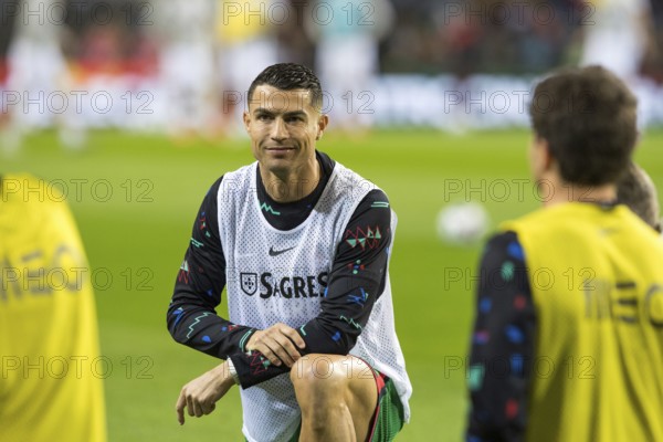 Football match, Cristiano RONALDO CR7 Portugal kneeling during pre-match warm-up with smiling and
