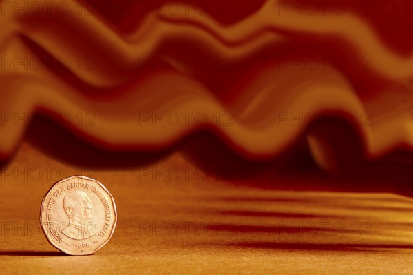 One single Indian currency two rupees coin and artistic background backside embossed Sardar