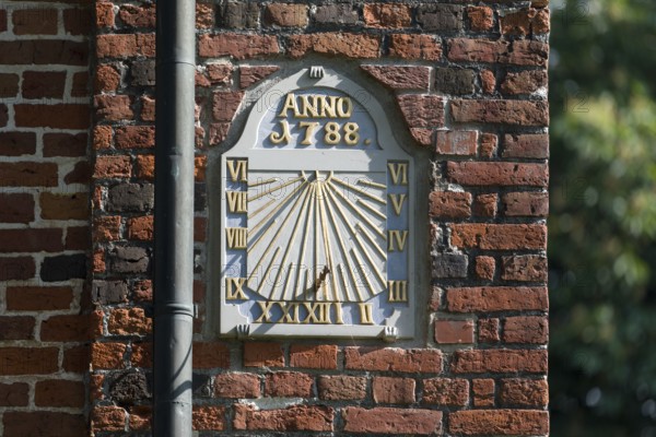 Sundial at the St. Nikolai Church in Altenbruch, district of the medium-sized town of Cuxhaven