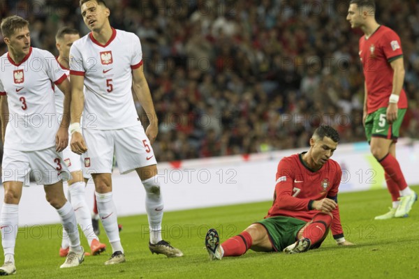 Football match, captain Cristiano RONALDO CR7 Portugal right has just been fouled and is sitting on