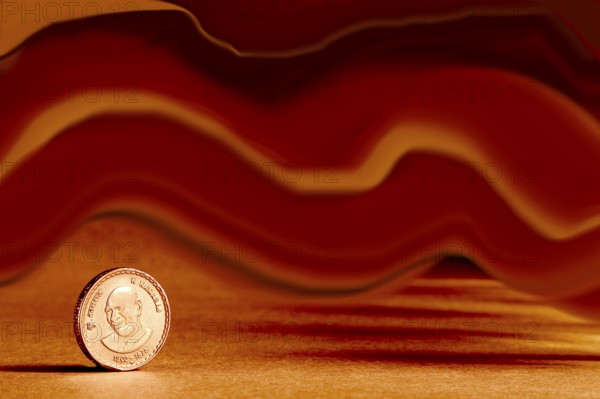 One single Indian currency five rupees coin and artistic background backside embossed K. Kamaraj