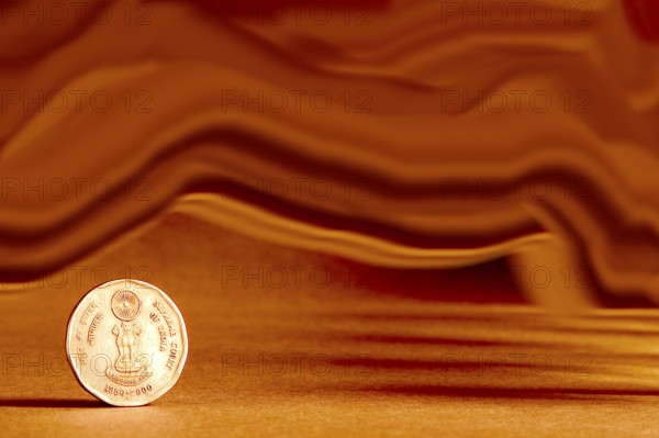 One single Indian currency two rupees coin and artistic background backside embossed Ashoka Pillar