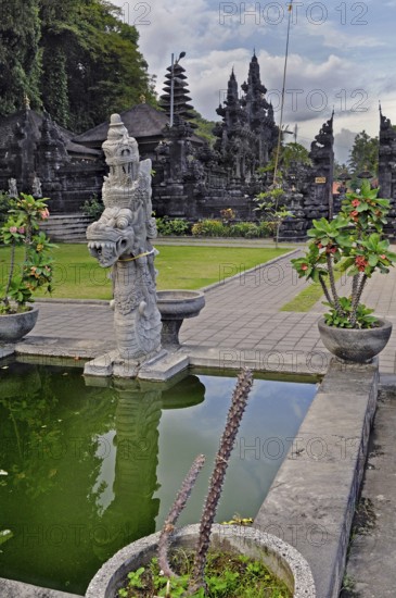 Stone mythological figure and water basin at the Goa-Lawah Temple, Bat Temple, Bali, Indonesia,