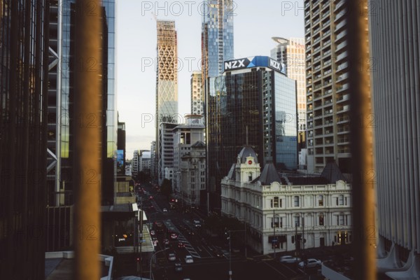 View of a busy street with the modern NZX skyscraper in the background, new zealand stock exchange,