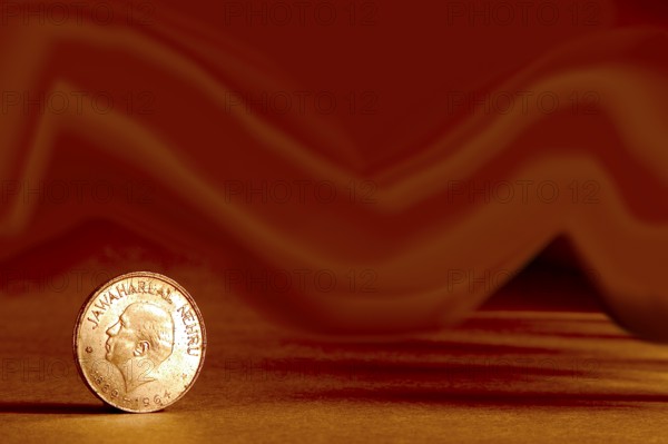 One single Indian currency one rupees coin and artistic background backside embossed Jawaharlal
